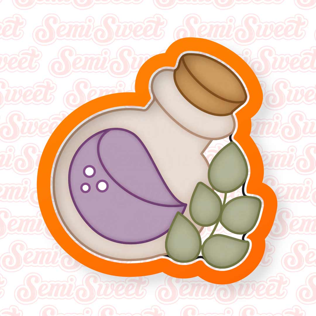potion bottle cookie cutter with an accent of a sprig of herbs.